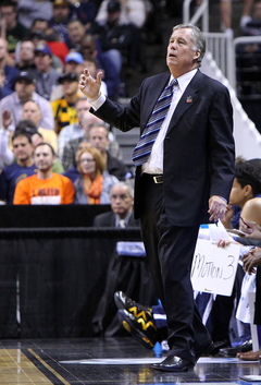 Head coach Mike Montgomery of the California Golden Bears gestures as he reacts to a play in the game against the Syracuse Orange.