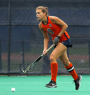 Laura Hahnefeldt dribbles the ball in Syracuse's victory. The SU back assisted on both of the Orange's penalty-corner goals.