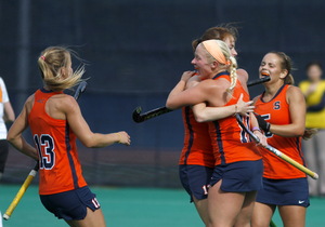 Syracuse teammates maul freshman midfielder Serra Degnan after she scored her first career goal.