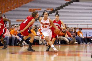 Iasia Hemingway (43) dribbles the ball in SU's 72-69 victory over Northeastern Friday.