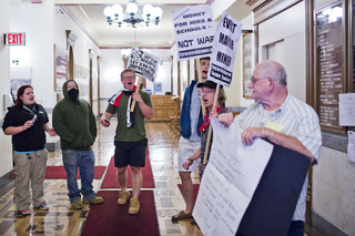 Occupy supporters yelled inside City Hall and were soon greeted by the Syracuse Police Department. 