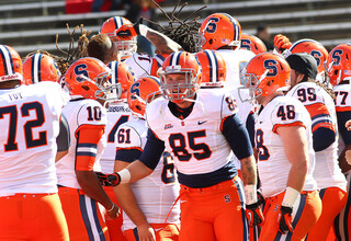 Syracuse tight end Beckett Wales (85) and the rest of the Orange try and get pumped up before the game.