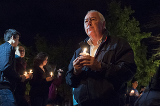 Oct. 8, 2013: Graham Herbert, the principal of Lockerbie Academy in Scotland, pays his respects to the 35 SU students who died in the Pan Am Flight 103 bombing at a candlelight vigil. The 25th anniversary of the tragedy is recognized through Remembrance Week 2013.