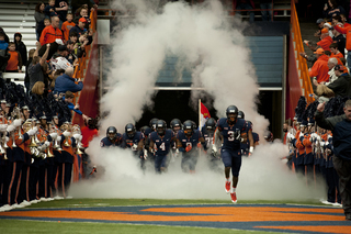 Safety Durell Eskridge leads Syracuse on to the field before its crucial game against Pittsburgh.