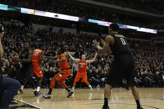 Tyler Roberson, Joseph and Cooney attempt to swarm the Panthers, but Pitt still secured the ball.