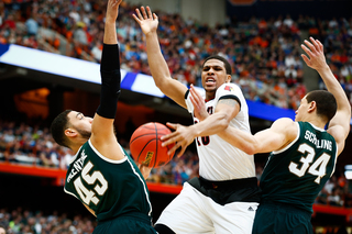 Louisville scrambles for a rebound at the start of overtime. 