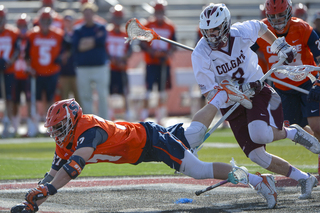 Williams dives for a ball on the turf. 