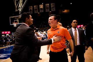 Syracuse celebrates following the win. 